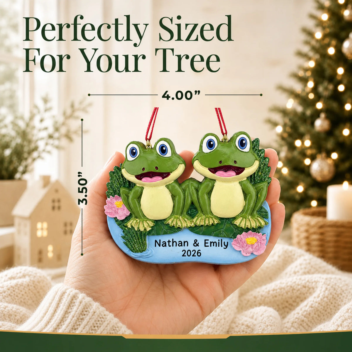 Size guide: the personalized frog pond couple christmas ornament is 4.00 in wide by 3.50 in tall, shown in hand