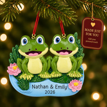 Frog pond couple christmas ornament hanging on a lit Christmas tree with a Made Just For You gift tag