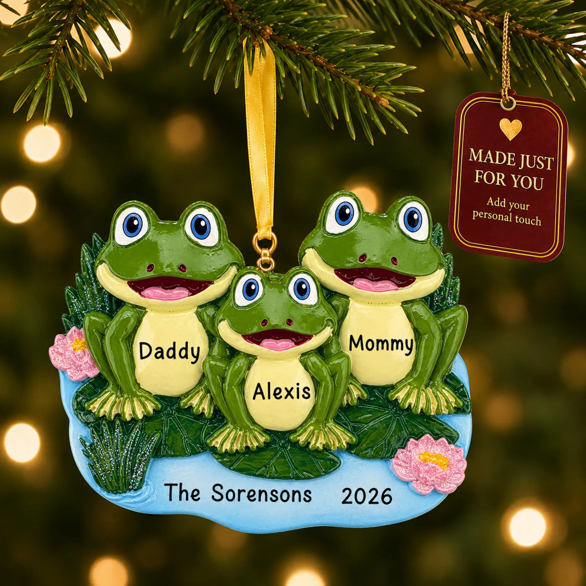 Frog family of 3 christmas ornament hanging on a lit Christmas tree with a Made Just For You gift tag