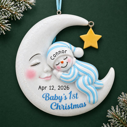 Personalized blue snowman baby's 1st christmas ornament on a dark green pine background