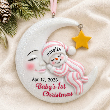 Personalized pink snowman baby's 1st christmas ornament laid on a soft white knit blanket