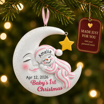 Pink snowman baby's 1st christmas ornament hanging on a lit Christmas tree with a Made Just For You gift tag
