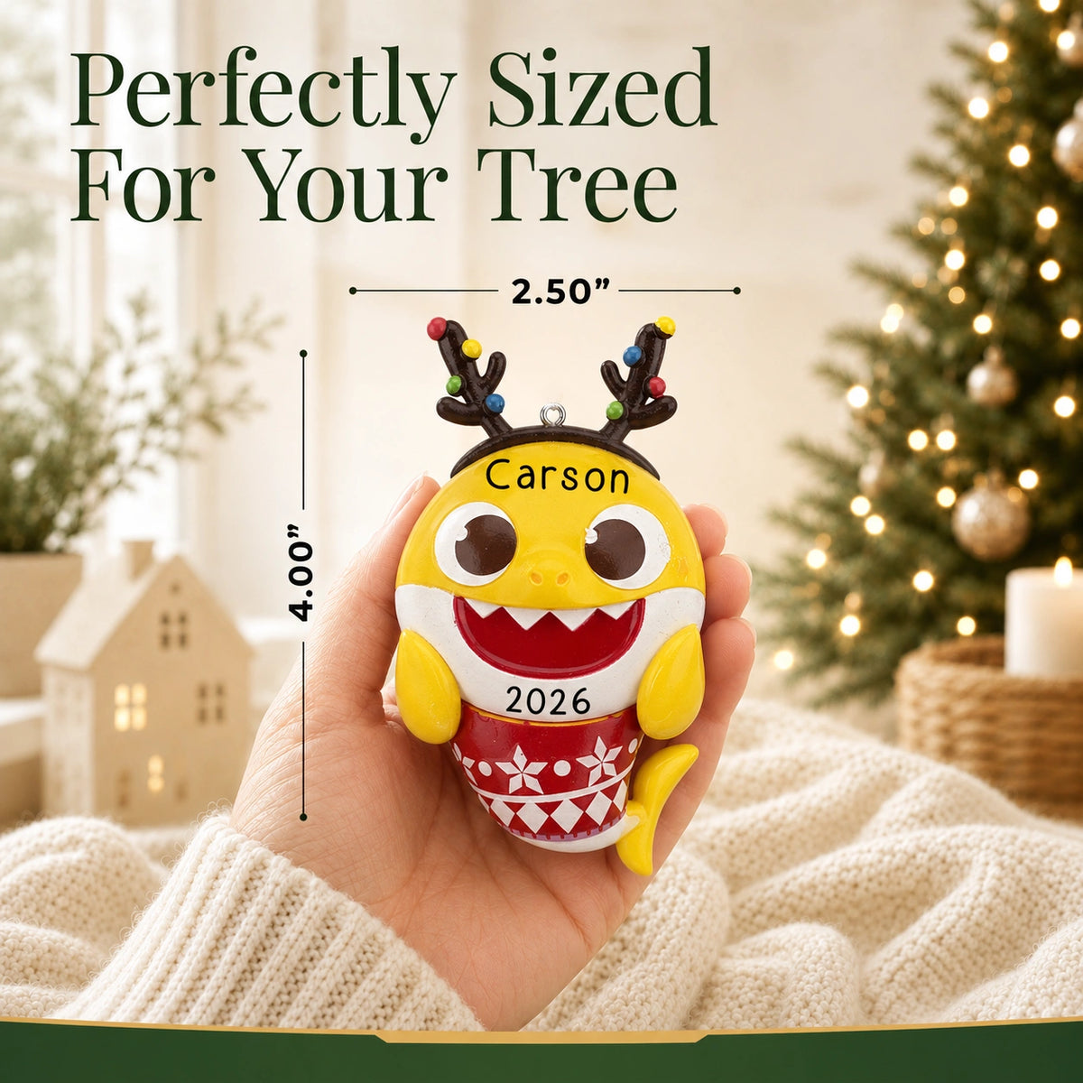 Personalized Baby Shark Christmas ornament held in hand to show size, about 2.5 inches wide by 4 inches tall