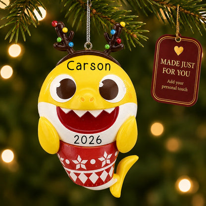 Personalized Baby Shark Christmas ornament hanging on a lit Christmas tree beside a Made Just For You gift tag