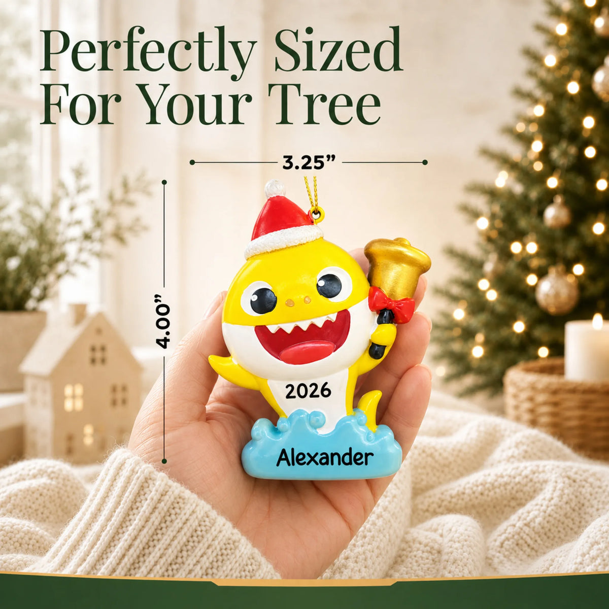 Size guide: the personalized Baby Shark Santa Hat christmas ornament is 3.25 in wide by 4.00 in tall, shown in hand