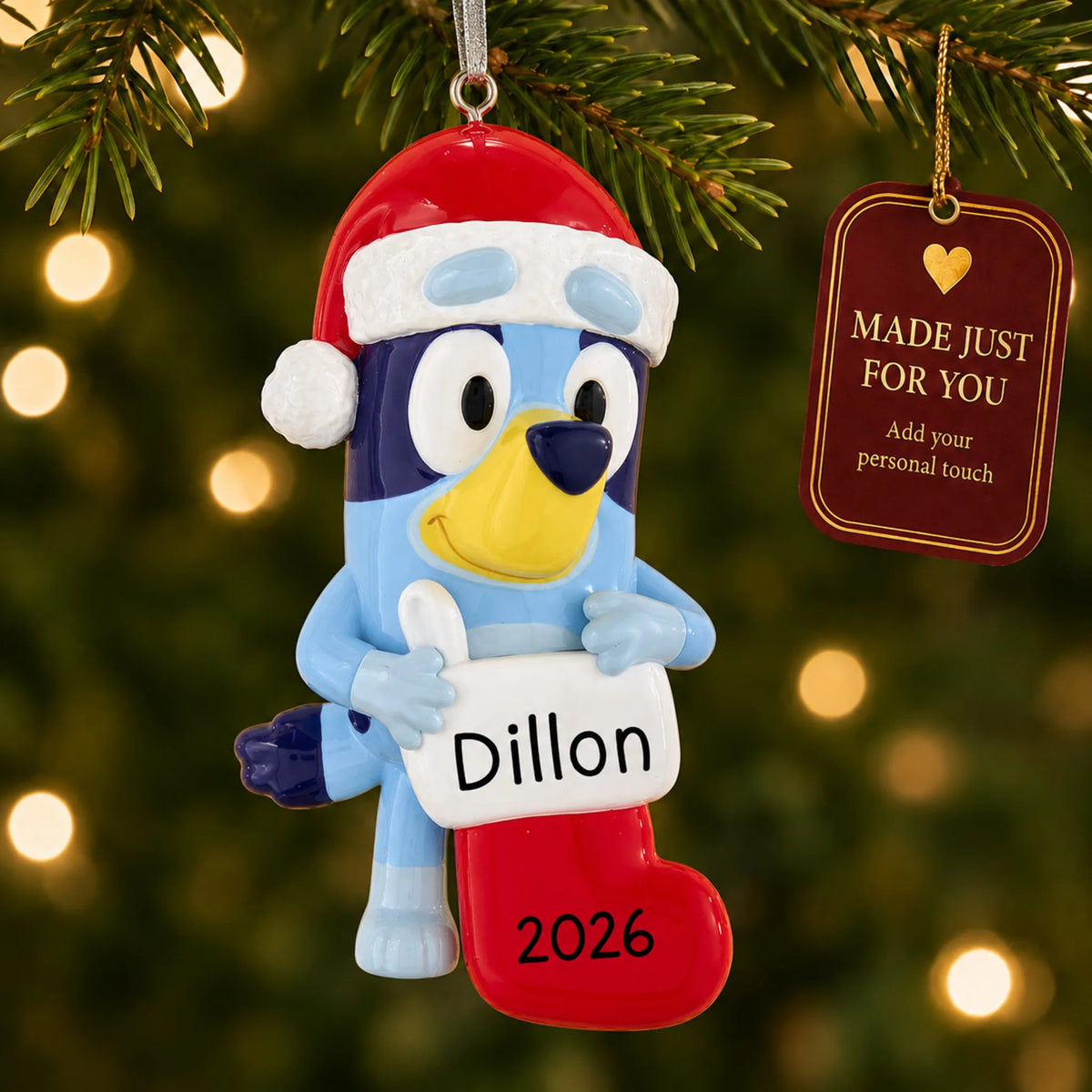 Bluey Stocking christmas ornament hanging on a lit Christmas tree with a Made Just For You gift tag
