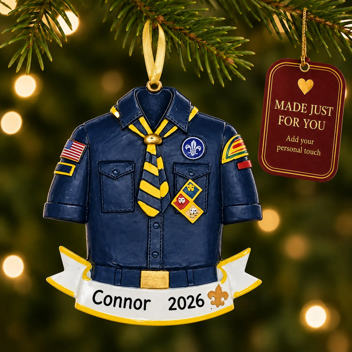 Cub Scout Boy Scouts christmas ornament hanging on a lit Christmas tree with a Made Just For You gift tag