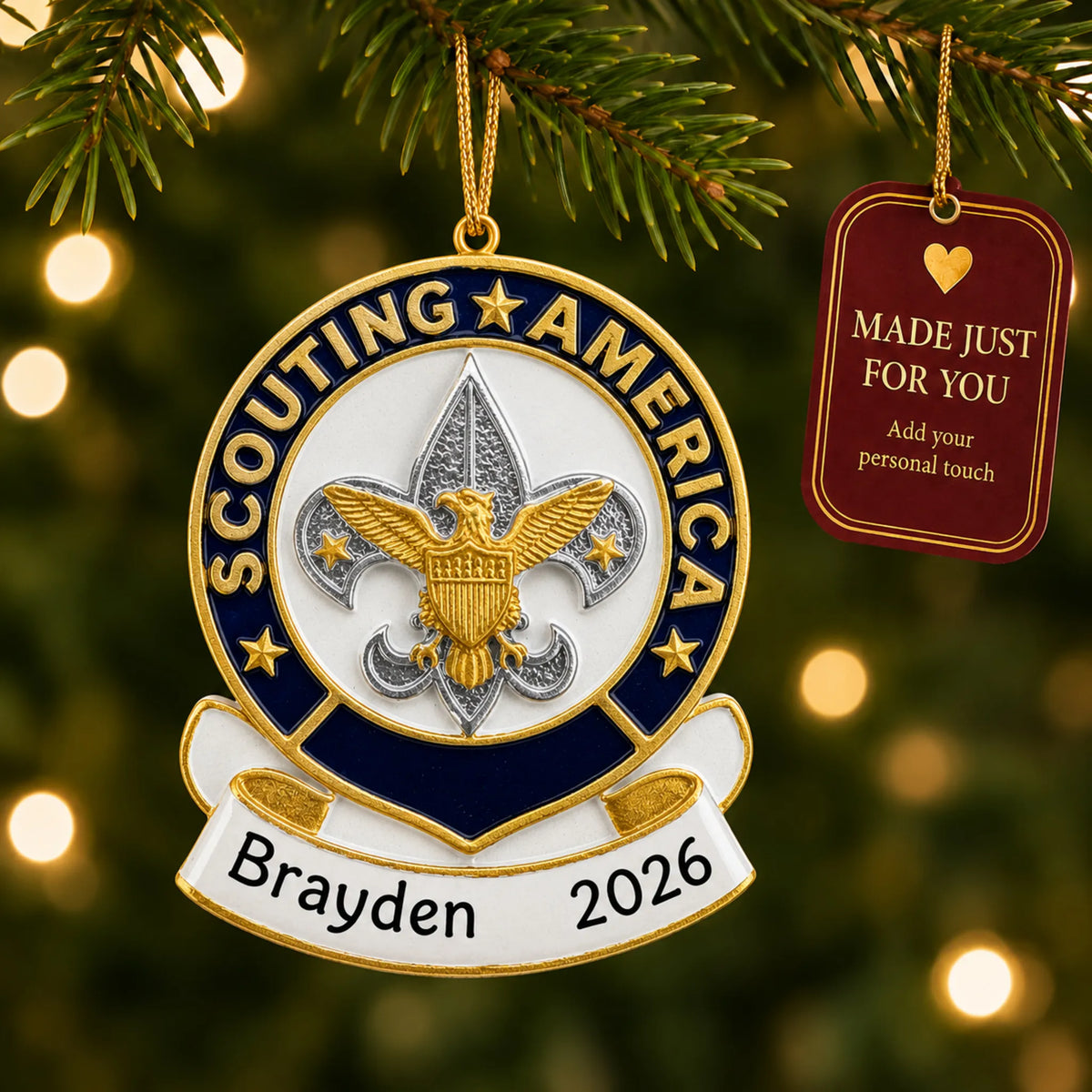 Scouting America christmas ornament hanging on a lit Christmas tree with a Made Just For You gift tag