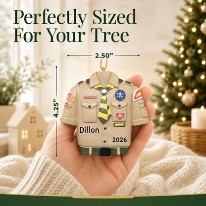 Size guide: the personalized Boy Scouts uniform christmas ornament shown in hand next to a Christmas tree