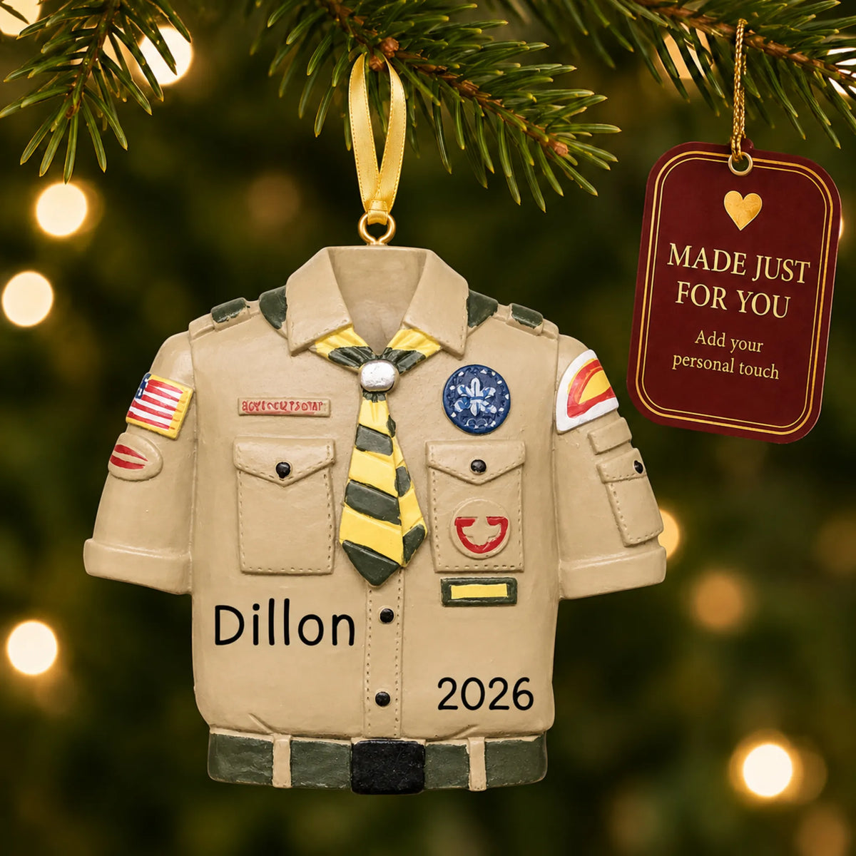 Boy Scouts uniform christmas ornament hanging on a lit Christmas tree with a Made Just For You gift tag
