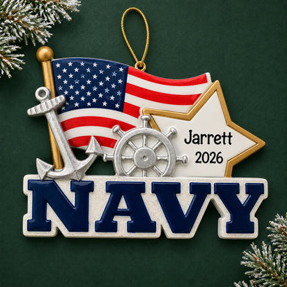 Personalized U.S. Navy flag and star Christmas ornament with name and year, shown on a green holiday background