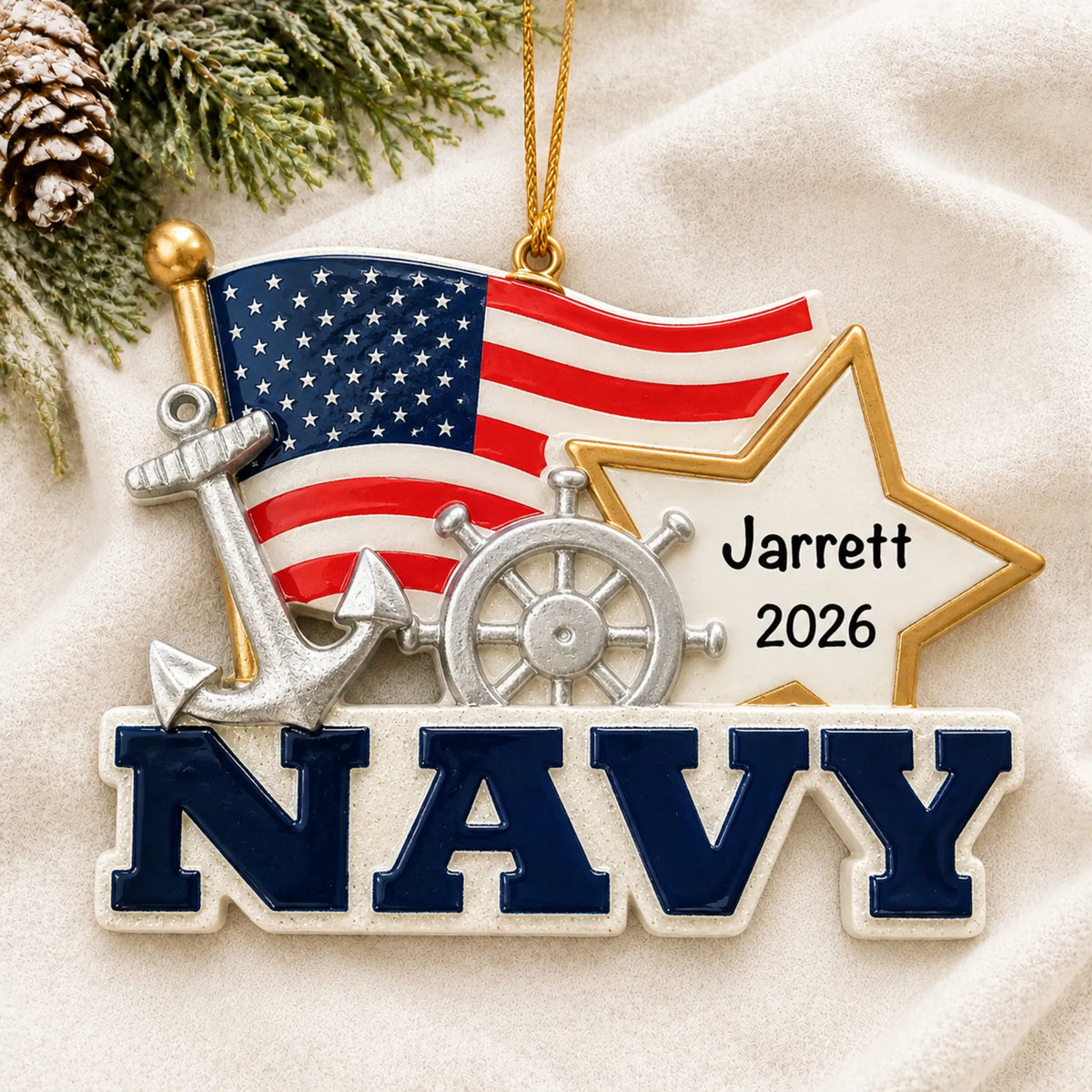 Personalized U.S. Navy flag and star Christmas ornament shown on a soft white blanket