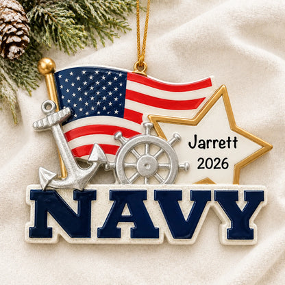 Personalized U.S. Navy flag and star Christmas ornament shown on a soft white blanket