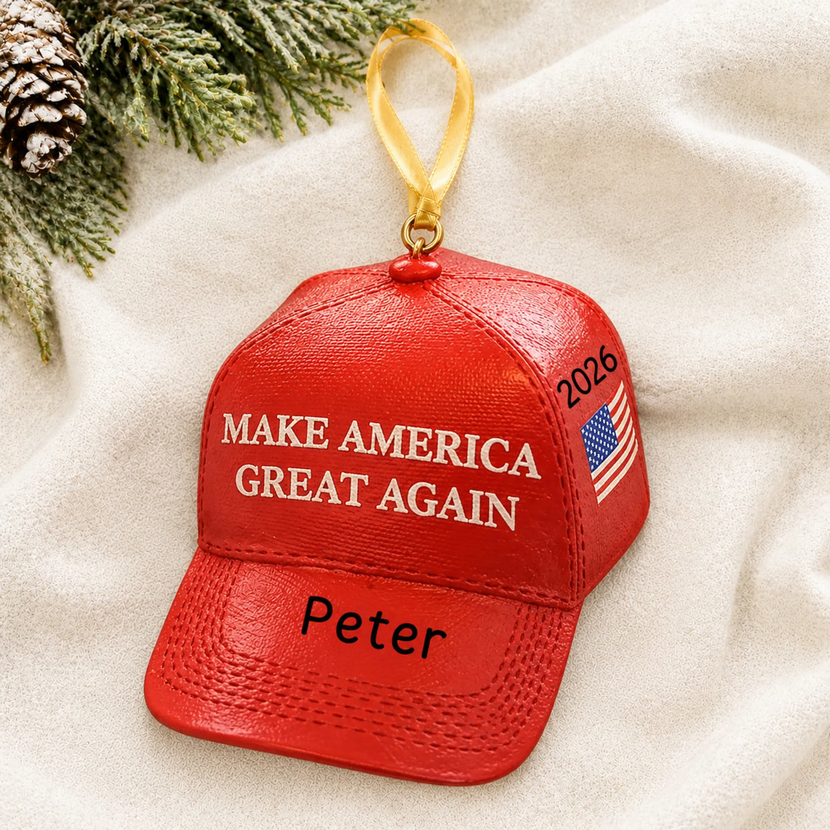 Personalized MAGA hat Christmas ornament shown on a soft white blanket