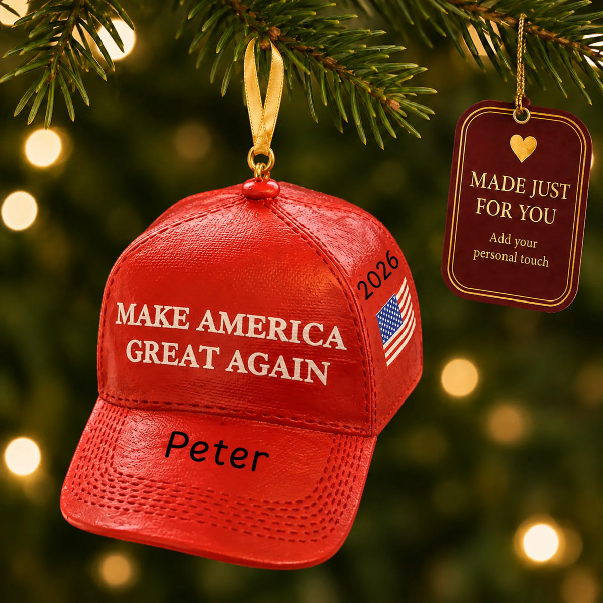 Personalized MAGA hat Christmas ornament hanging among tree lights with a Made Just For You tag