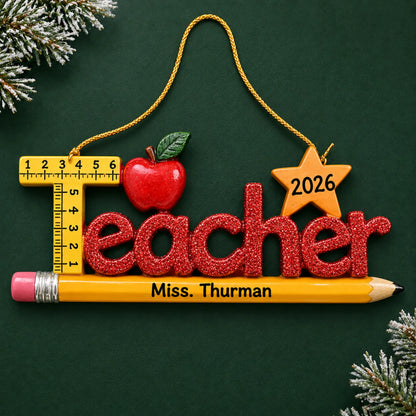 Personalized teacher's pencil Christmas ornament with name and year, shown on a green holiday background