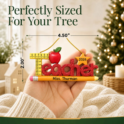 Personalized teacher's pencil Christmas ornament held in hand to show its size on the tree