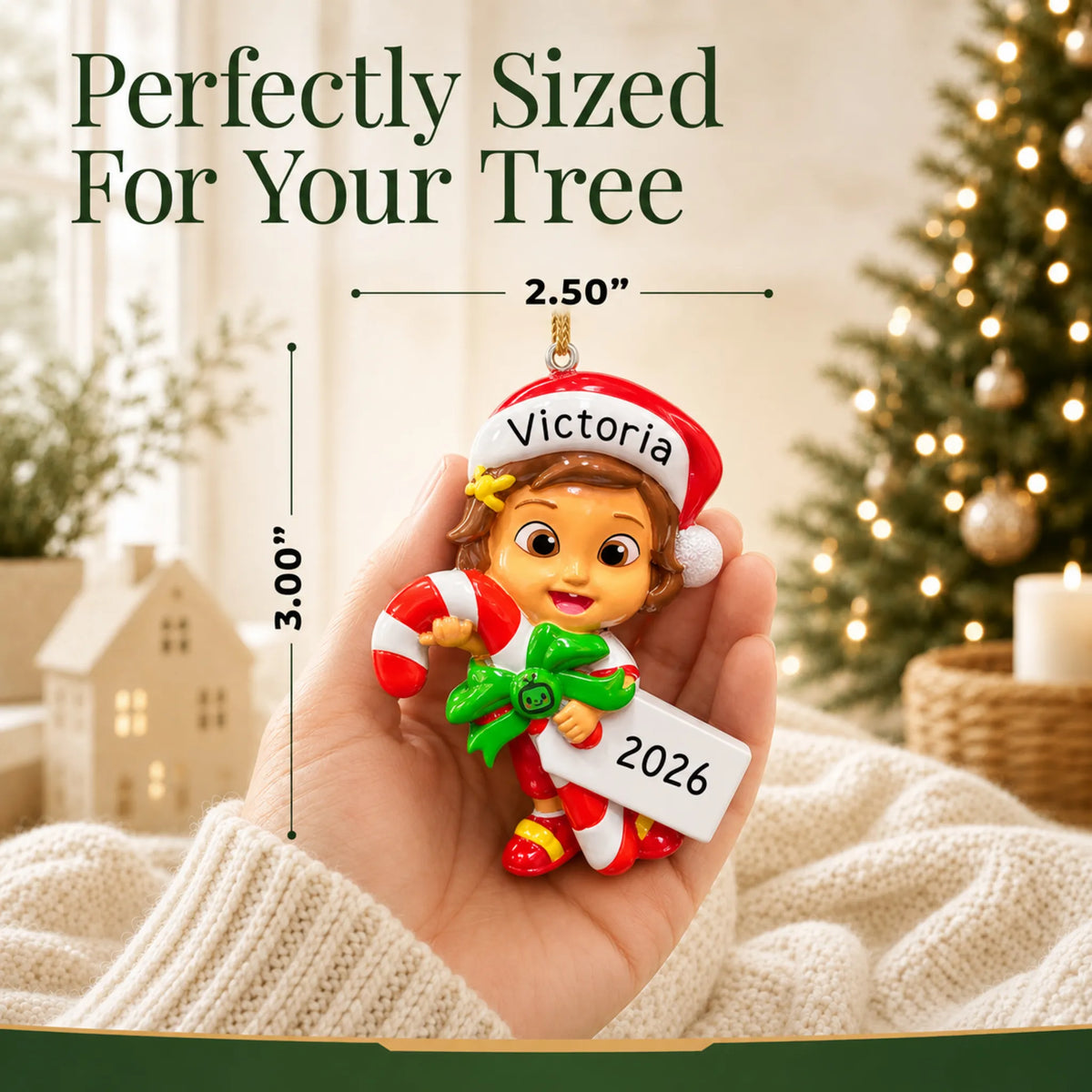 Size guide: the personalized CoComelon Nina christmas ornament is 2.50 in wide by 3.00 in tall, shown in hand