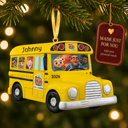 CoComelon School Bus christmas ornament hanging on a lit Christmas tree with a Made Just For You gift tag
