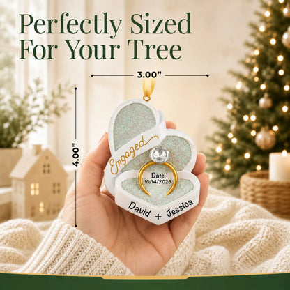 Personalized engagement ring box Christmas ornament held in a hand to show its 3 by 4 inch size