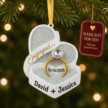 Personalized engagement ring box Christmas ornament on a lit Christmas tree with a Made Just For You tag