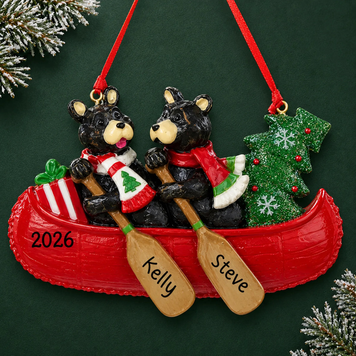 Personalized bear canoe couple christmas ornament on a dark green pine background