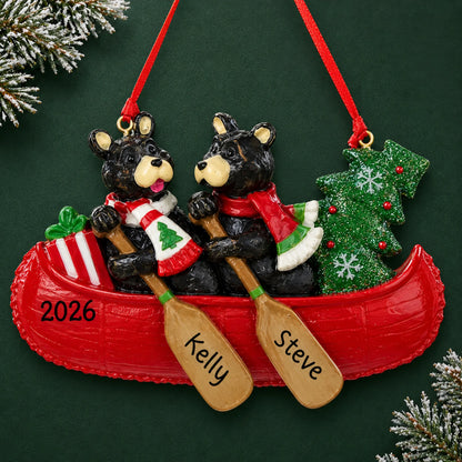 Personalized bear canoe couple christmas ornament on a dark green pine background