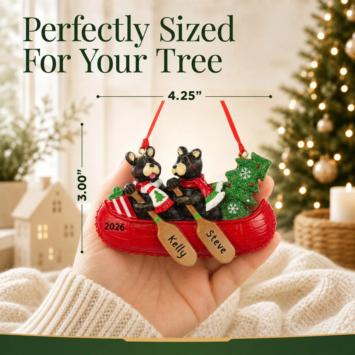 Size guide: the personalized bear canoe couple christmas ornament is 4.25 in wide by 3.00 in tall, shown in hand