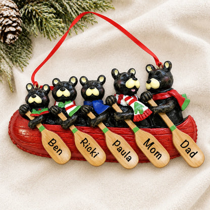 Personalized bear canoe family of 5 christmas ornament laid on a soft white knit blanket
