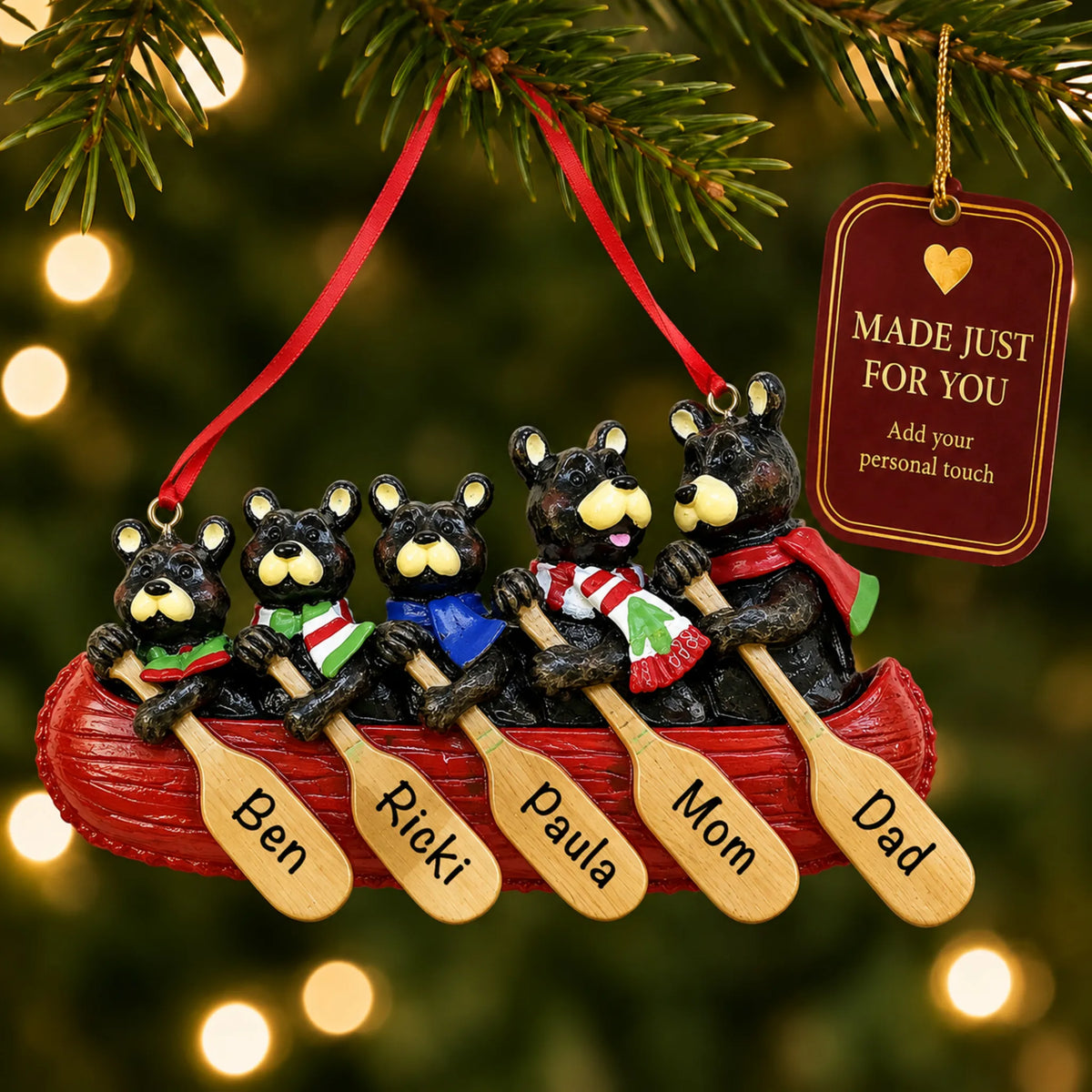 Bear canoe family of 5 christmas ornament hanging on a lit Christmas tree with a Made Just For You gift tag