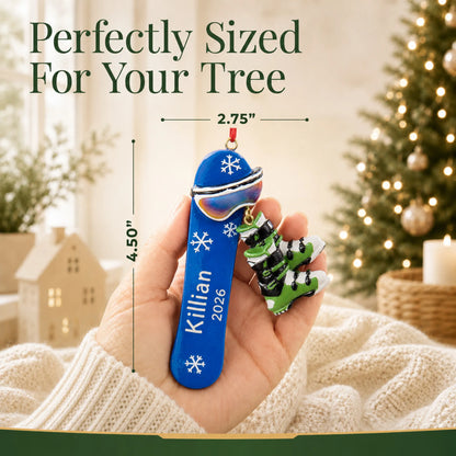 Size guide: the personalized snowboard with boots christmas ornament is 2.75 in wide by 4.50 in tall, shown in hand