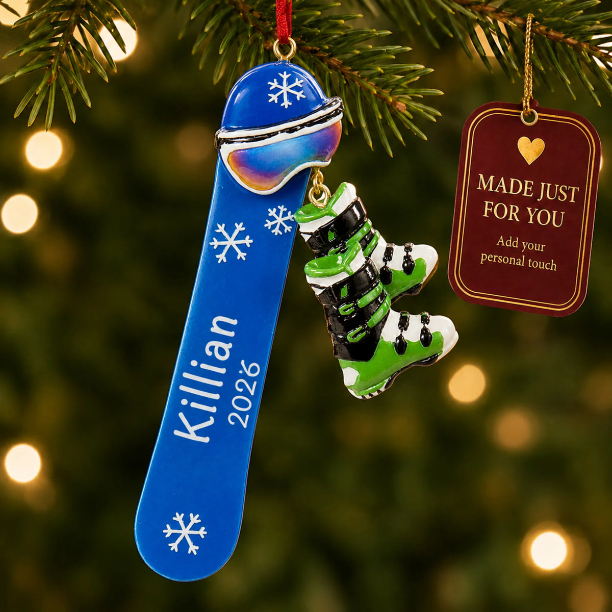 Snowboard with boots christmas ornament hanging on a lit Christmas tree with a Made Just For You gift tag