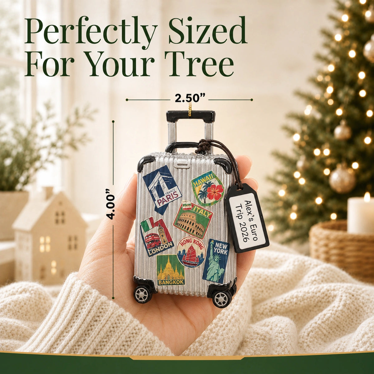Personalized travel suitcase Christmas ornament held in hand to show size, about 2.5 inches wide by 4 inches tall