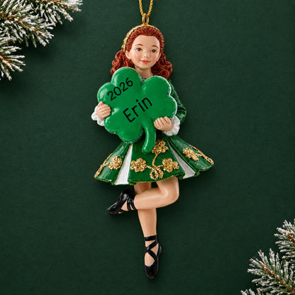 Personalized irish dancer holding shamrock christmas ornament on a dark green pine background