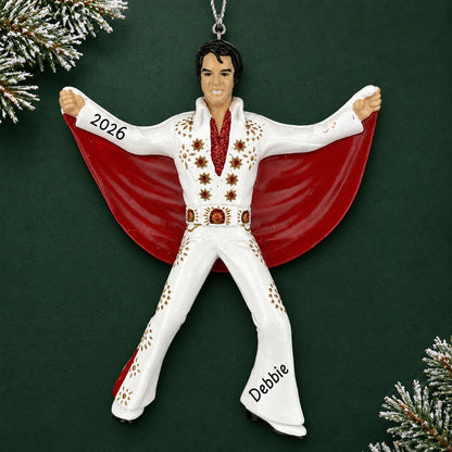 Personalized Elvis Presley Christmas ornament reading Debbie and 2026, shown on a dark green background with pine