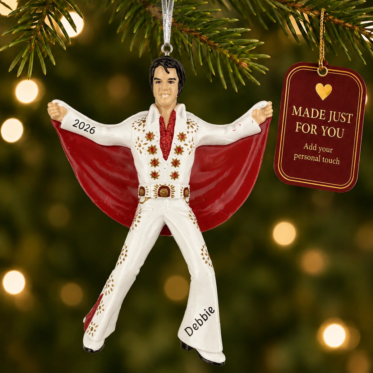 Personalized Elvis Presley Christmas ornament hanging on a lit Christmas tree beside a Made Just For You gift tag