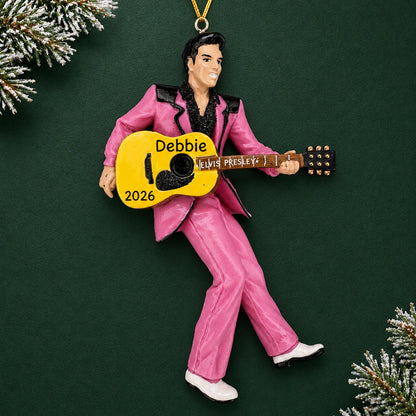 Personalized Elvis Presley guitar Christmas ornament reading Debbie 2026, shown on a dark green background with pine