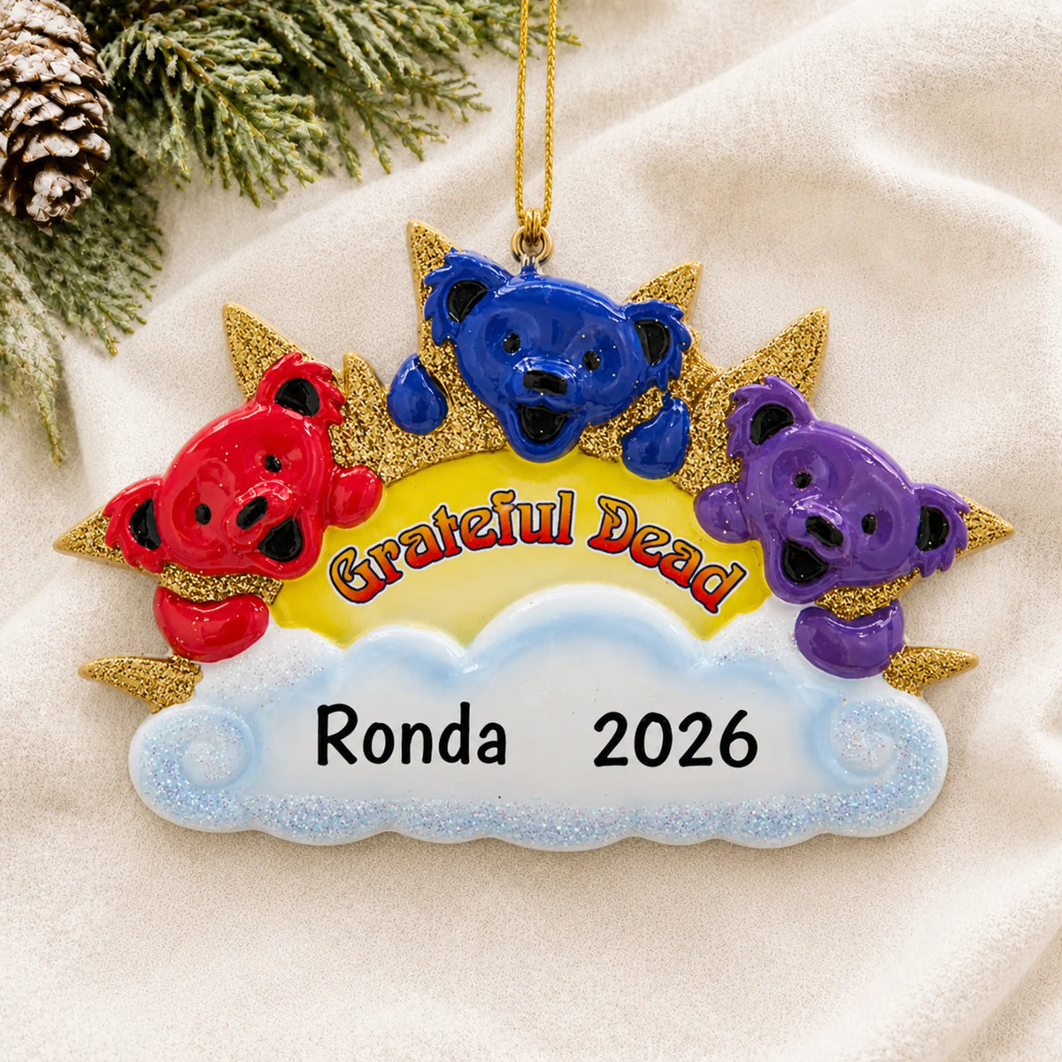 Personalized dancing bears christmas ornament laid on a soft white knit blanket
