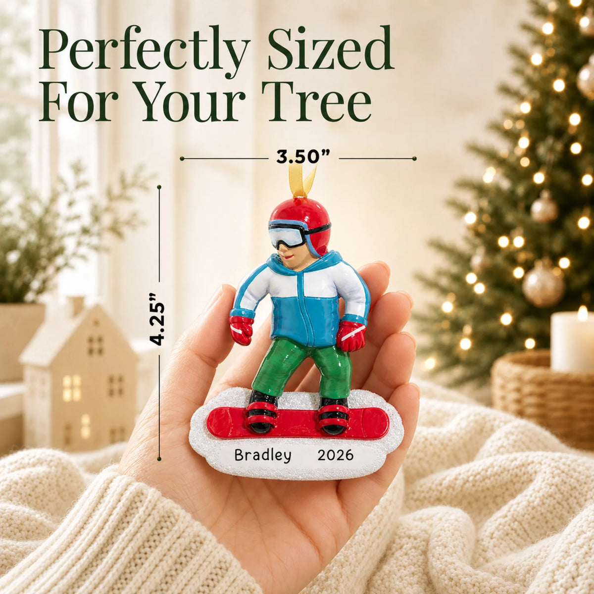 Size guide: the personalized snowboarding guy christmas ornament shown in hand next to a Christmas tree
