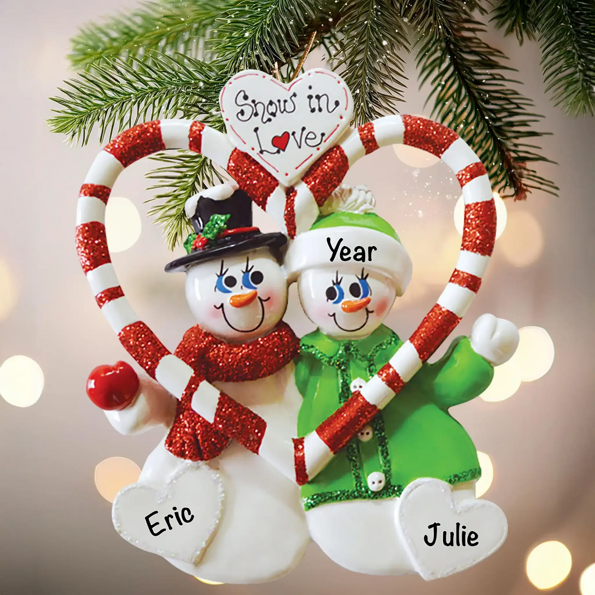 Personalized snowman couple ornament on a Christmas tree