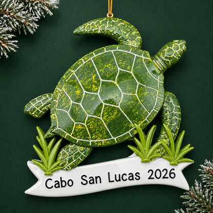 Personalized sea turtle christmas ornament on a dark green pine background