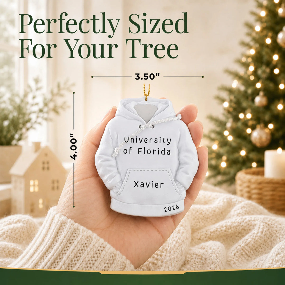 Personalized college hoodie Christmas ornament held in hand to show its size on the tree