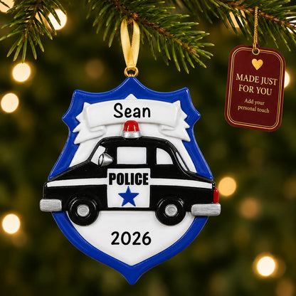 Police badge emblem christmas ornament hanging on a lit Christmas tree with a Made Just For You gift tag