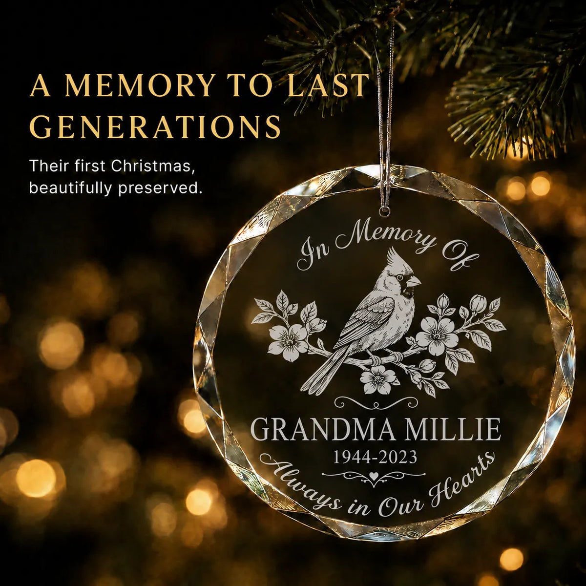 Glass cardinal memorial christmas ornament engraved In Memory Of with a name and dates, glowing by warm holiday lights
