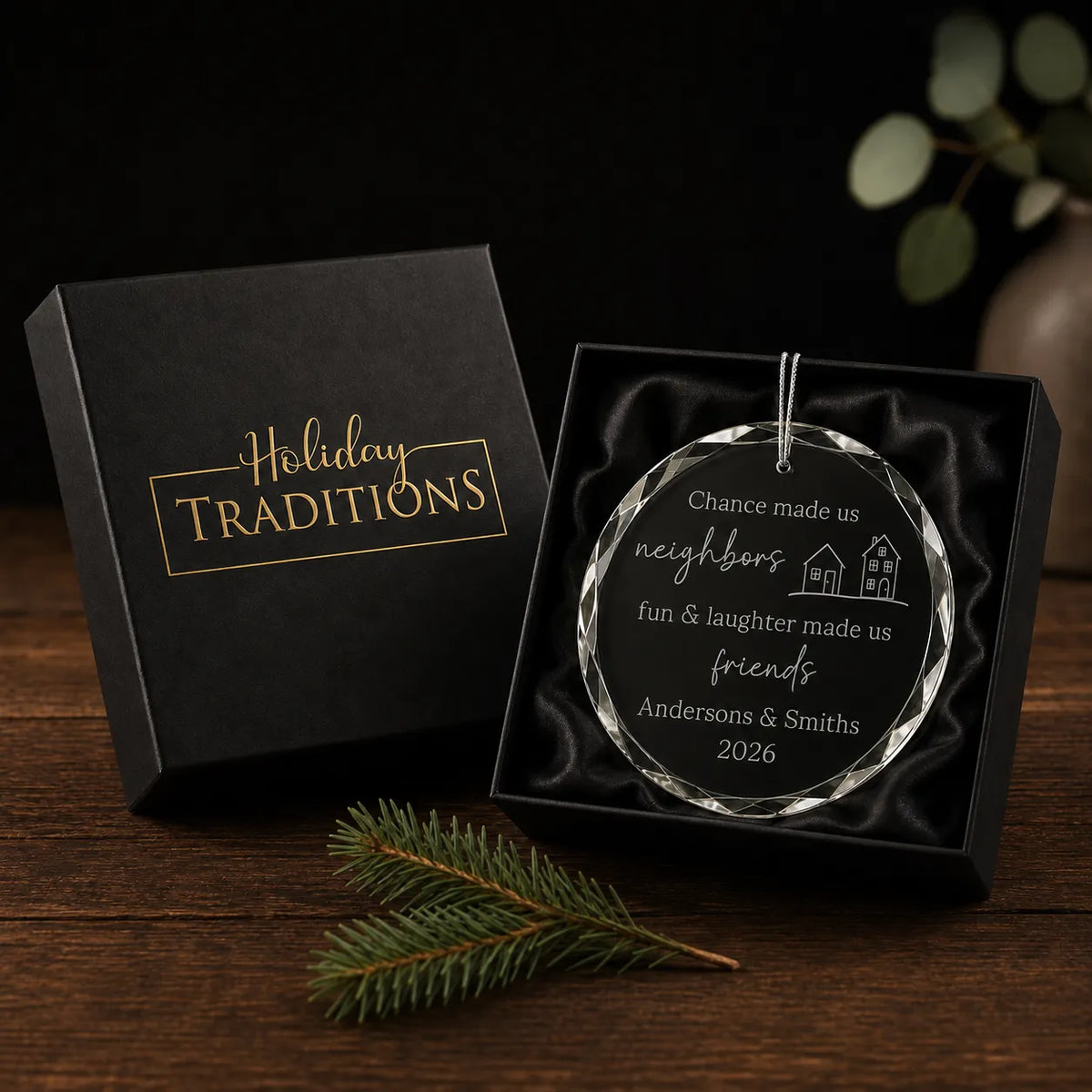 Chance made us neighbors glass christmas ornament in a black Holiday Traditions gift box with satin lining