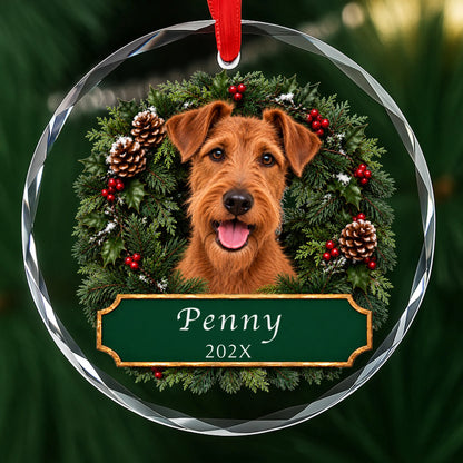 Personalized Irish Terrier Christmas ornament in round glass with a holly wreath and a green plaque engraved with a name and year