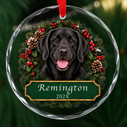 Personalized black Lab Christmas ornament in round glass with a holly wreath and a green plaque engraved with a name and year