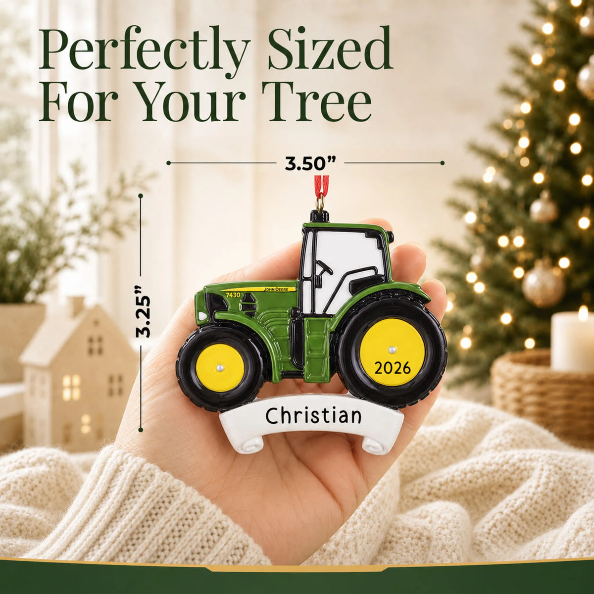 Size guide: the personalized green farm tractor christmas ornament shown in hand next to a Christmas tree
