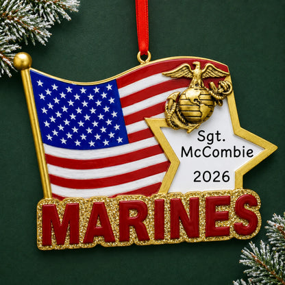 Personalized Marines U.S. flag Christmas ornament with name and year, shown on a green holiday background
