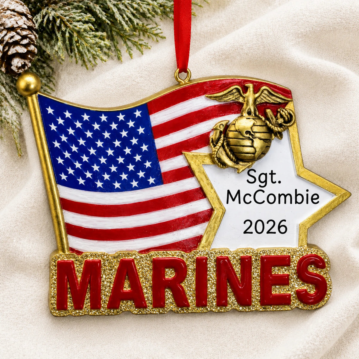Personalized Marines U.S. flag Christmas ornament shown on a soft white blanket